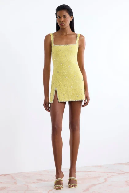 Front view of yellow dress with crystals showing square neck and side split