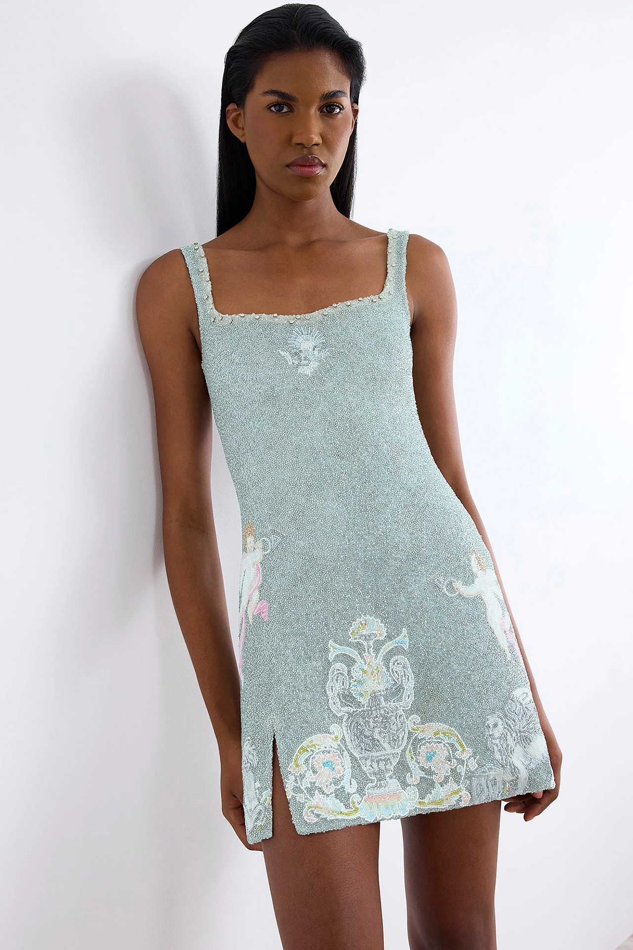 Luxury beaded party mini dress styled with silver heels for a sparkly dress for date night look