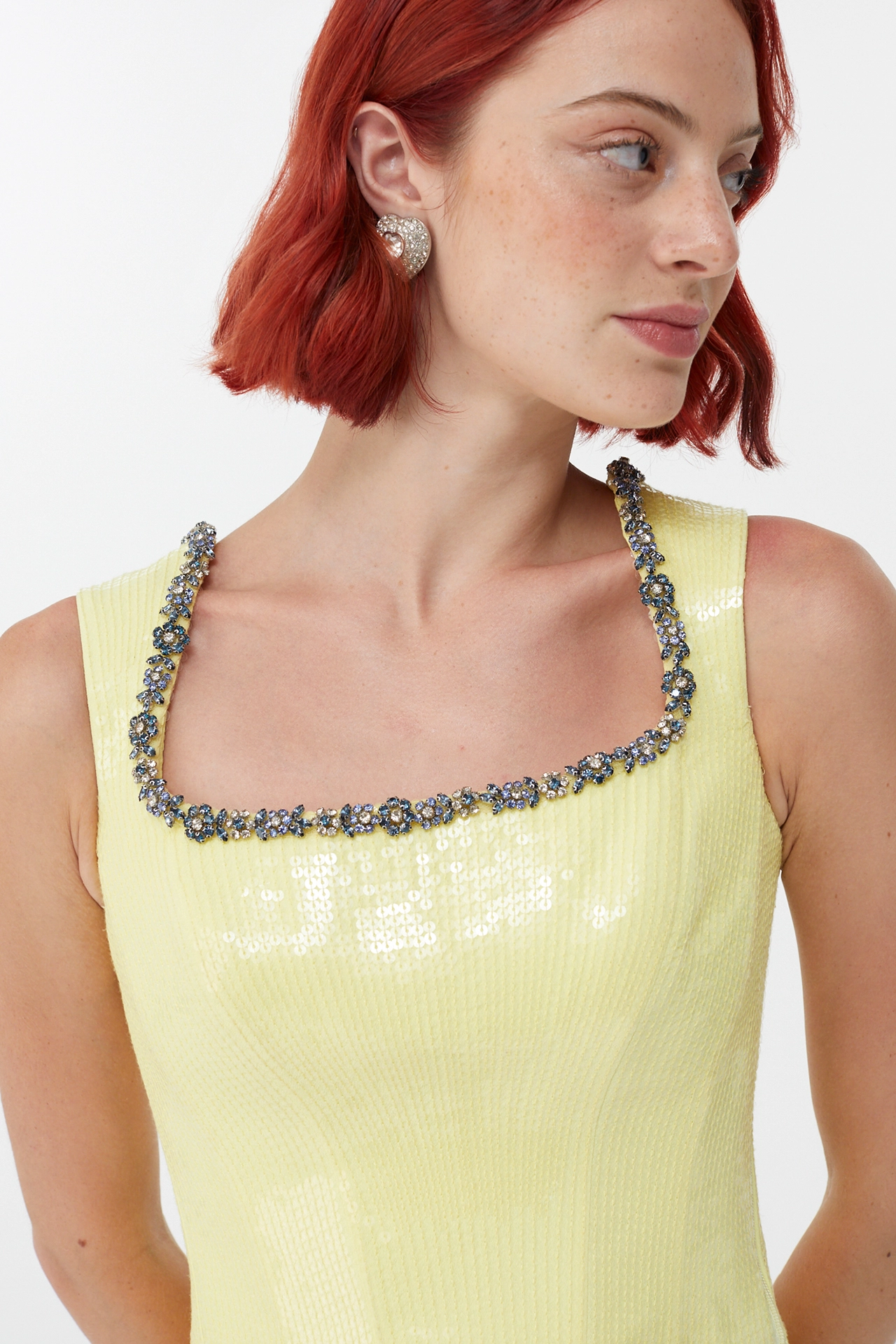 Close-up of square neck corset top decorated with blue and silver crystal borders