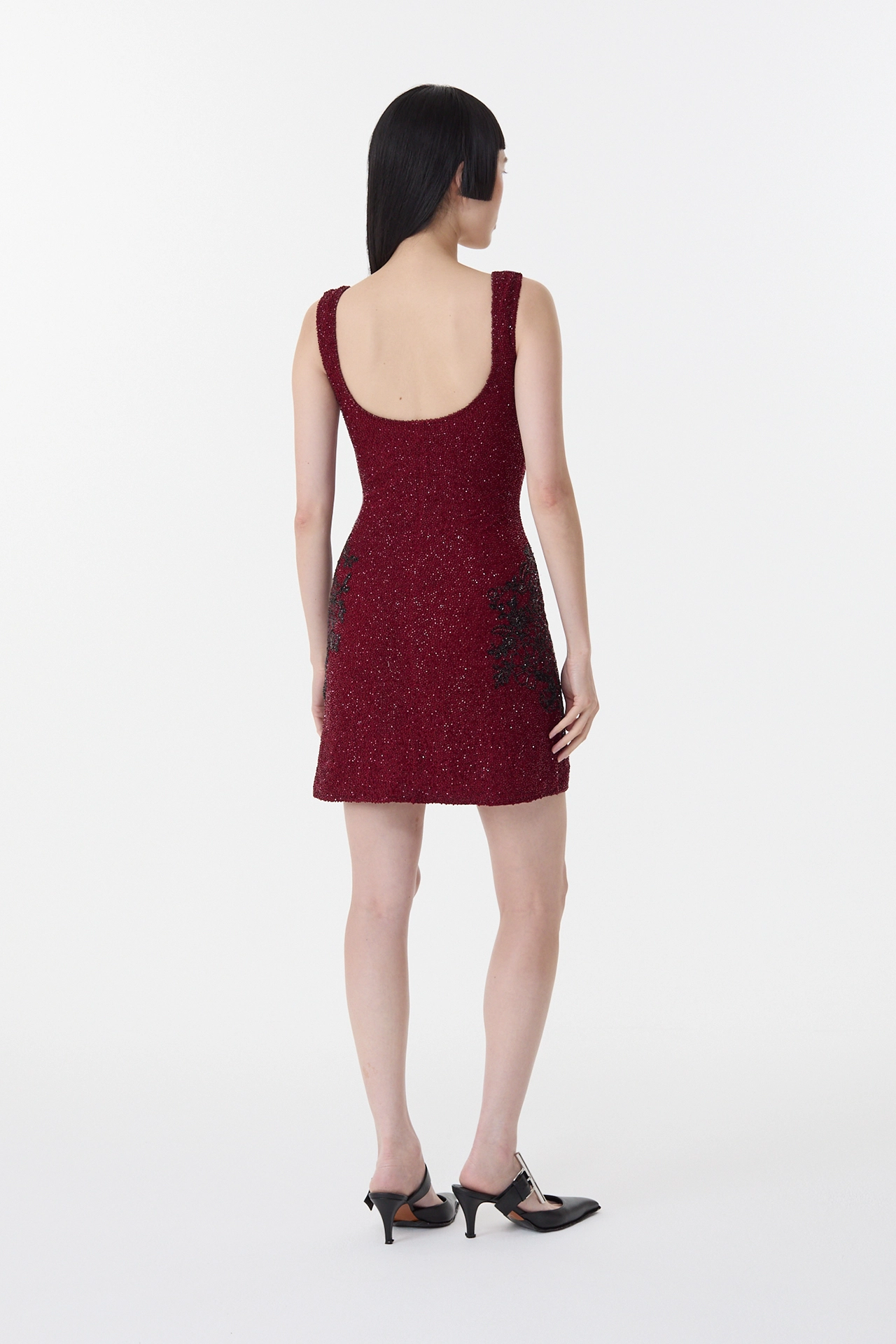 Low scoop back view of garnet red short dress with premium lining