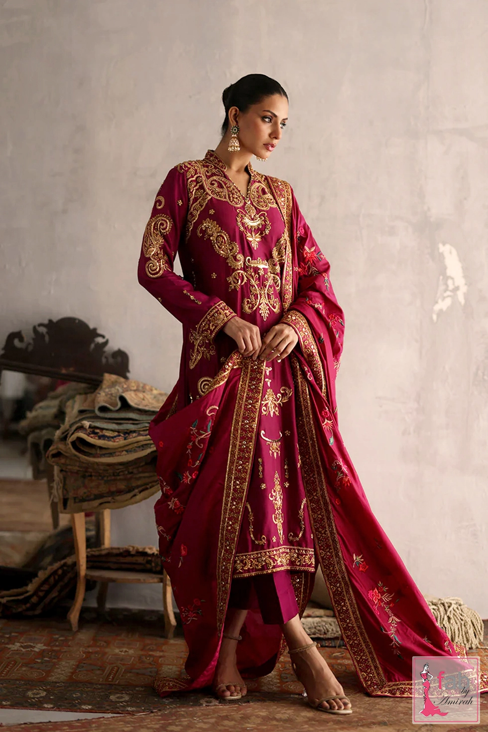 Full length side angle of luxury gulrukh magenta dress for wedding guests