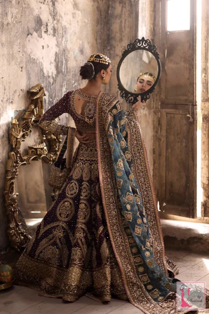 Back profile of embroidered choli showing heavy adda work
