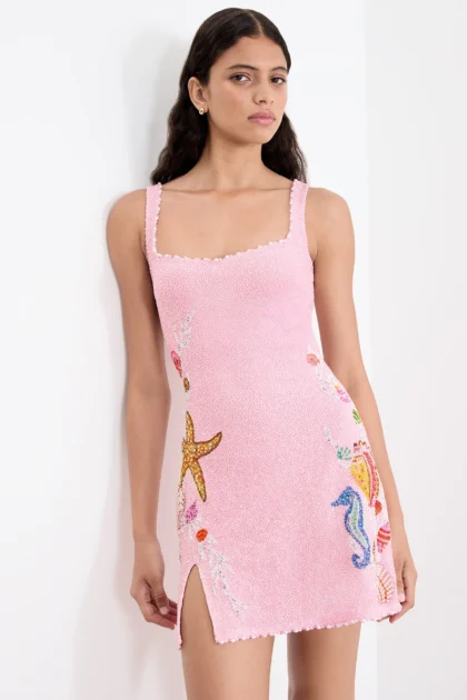 Rose pink cocktail dress with split showing heavy hand embellishments by Fab by Amirah