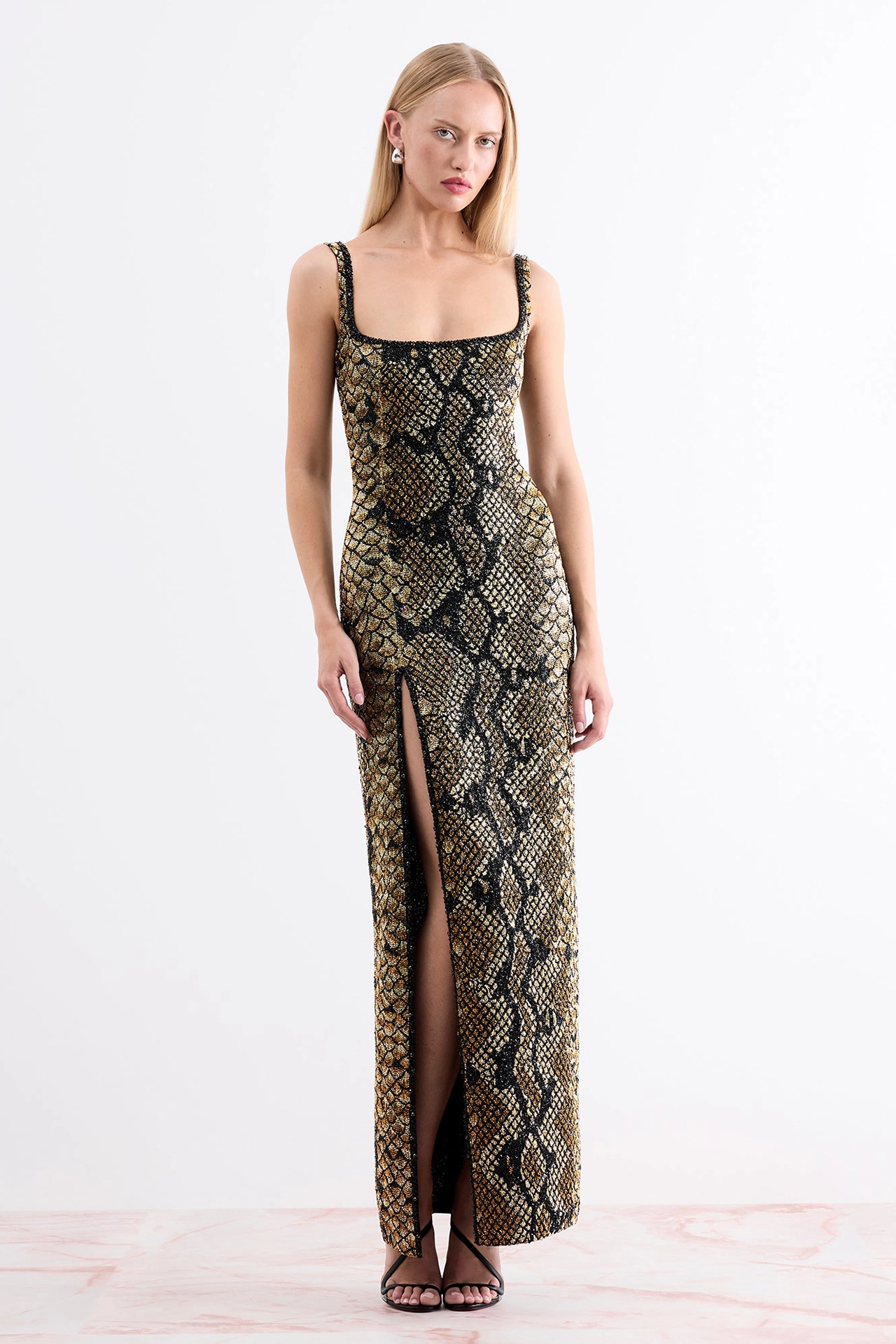Full length front view of beautiful snakeskin print evening dress with a high thigh split