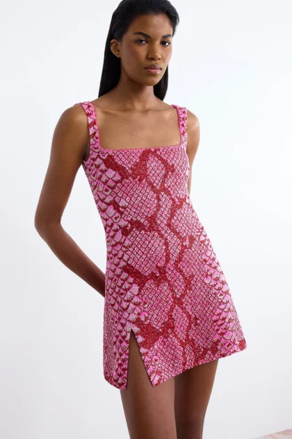 Hot pink cocktail dress with red encrusted square neckline and side slit