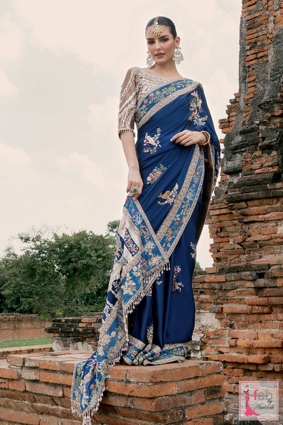 Intricate Aari embroidery patterns detailing on pure charmeuse silk pallu