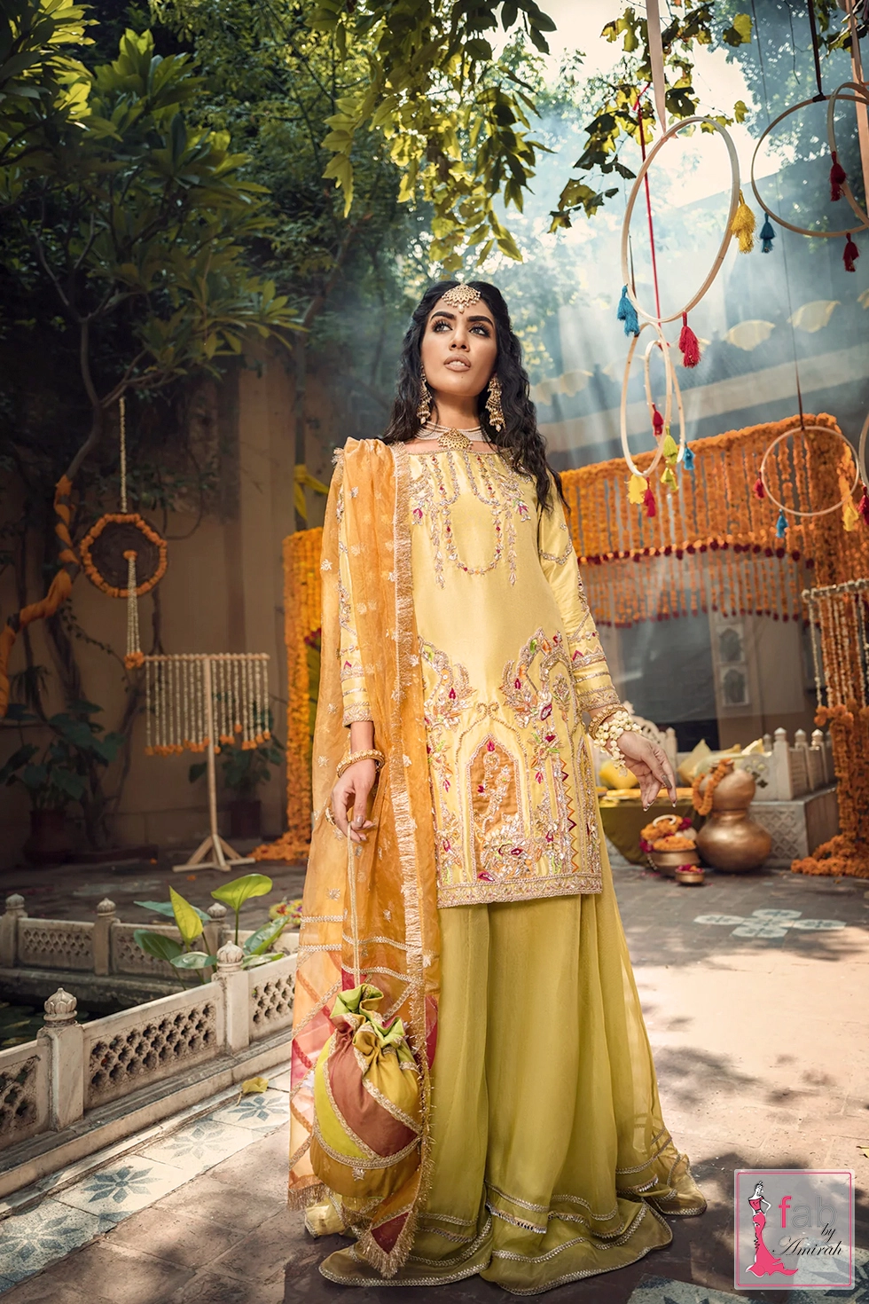The colorful geometric patches of the chatta patti dupatta trimmed with gold lace and traditional kiran fringe