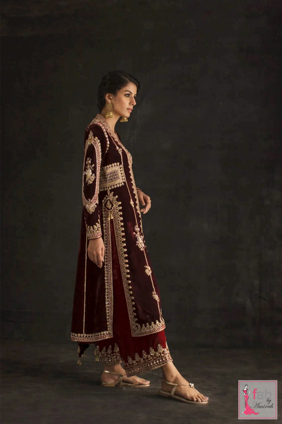 Side view of premium dark maroon velvet jacket with split panels Side view of premium dark maroon velvet jacket with split panels