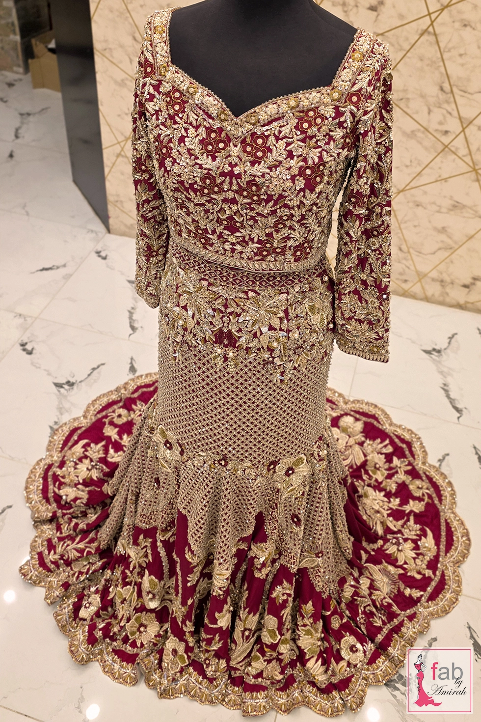 Deep plum fishtail mermaid lehenga with opulent gold zardozi border work