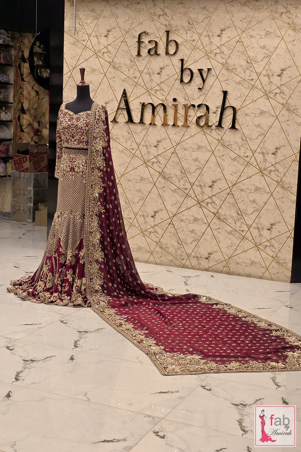 Dramatic extended long trail dupatta drapes over deep plum bridal lehenga