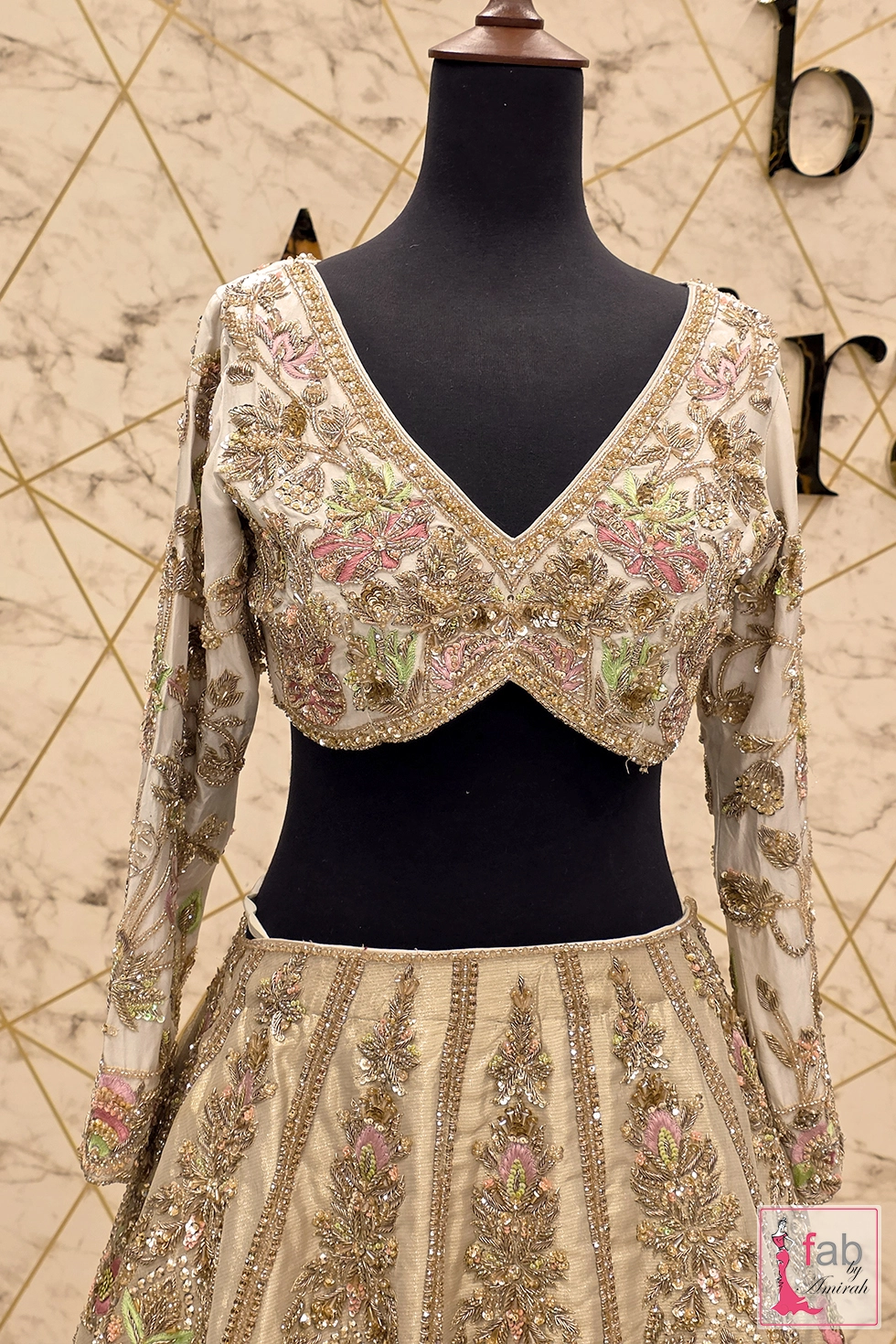Close-up of zardozi and dabka embroidery on pure raw silk choli Close-up of zardozi and dabka embroidery on pure raw silk choli