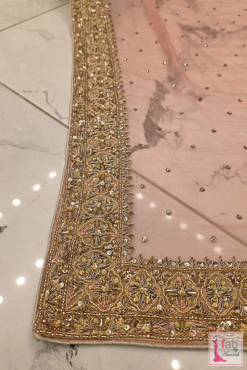 Heavily embroidered border details on premium blush pink tissue net dupatta Heavily embroidered border details on premium blush pink tissue net dupatta