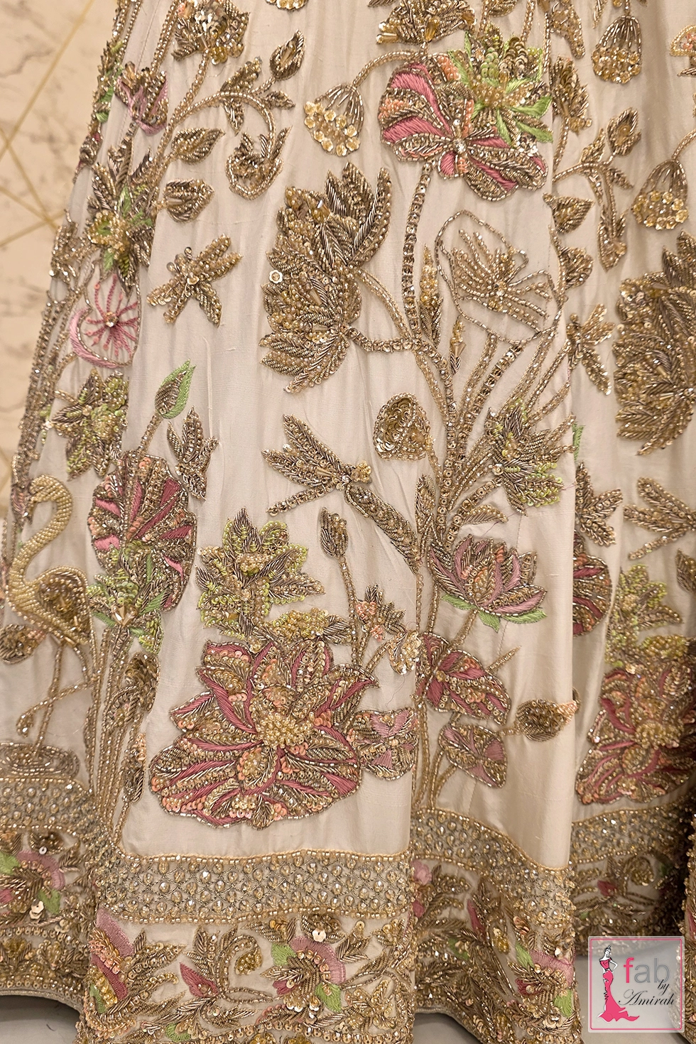 Back profile of heavily embellished ivory silk bridal lehenga Barat silhouette Back profile of heavily embellished ivory silk bridal lehenga Barat silhouette