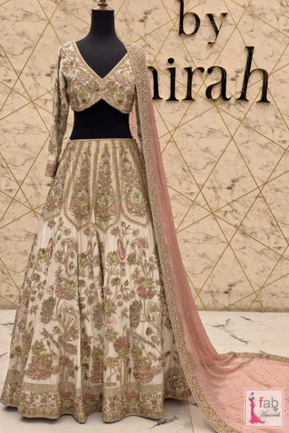 Ivory silk bridal lehenga Barat with intricate pastel embroidery by Fab By Amirah
