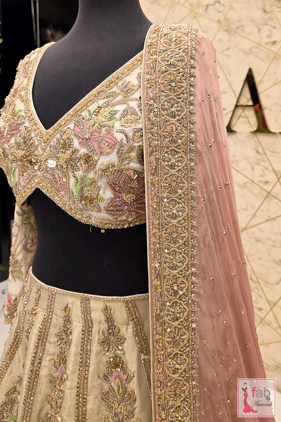 Close-up of zardozi and dabka embroidery on pure raw silk choli Close-up of zardozi and dabka embroidery on pure raw silk choli