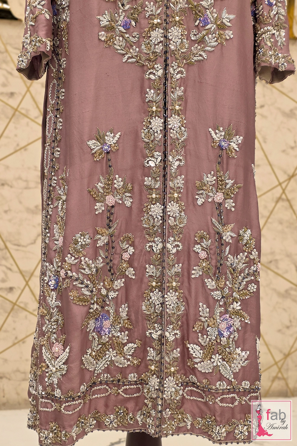 Close-up of premium kora and sequins embroidery on mauve raw silk shirt Close-up of premium kora and sequins embroidery on mauve raw silk shirt