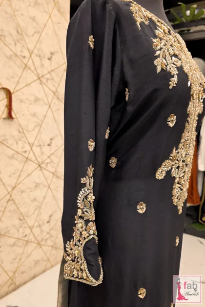 FAB By AMIRAH 5 Close-up of champagne tilla and micro-pearl embroidery on jet black raw silk tunic