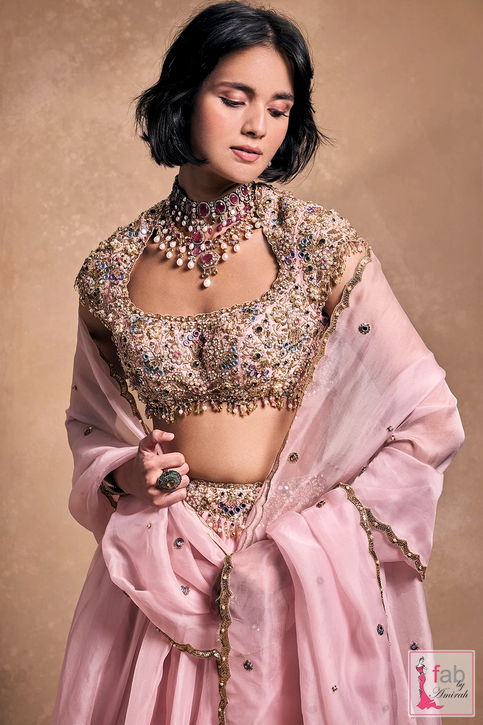 Close up portrait featuring embellished blouse and stone jewelry Close up portrait featuring embellished blouse and stone jewelry