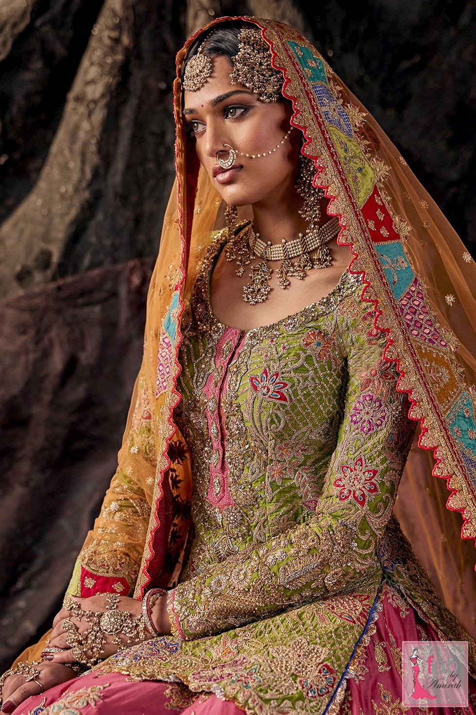 Close up view of hand embroidered green kurti with zardozi and tilla details
