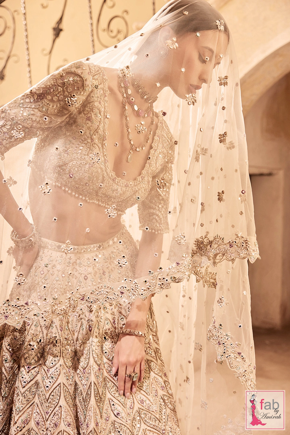 Side angle showing structured raw silk lehenga flair and draped dupatta border