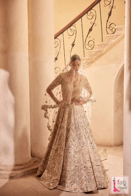 FAB By AMIRAH 11 Full pose of champagne lehenga set showing flared skirt silhouette