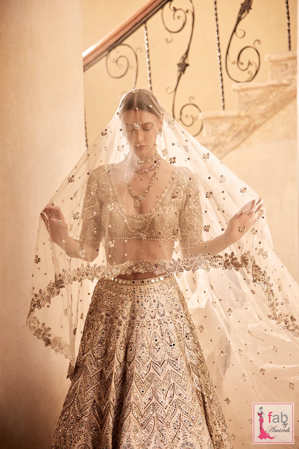 Bride wearing sheer net dupatta veil with hand embroidered floral borders
