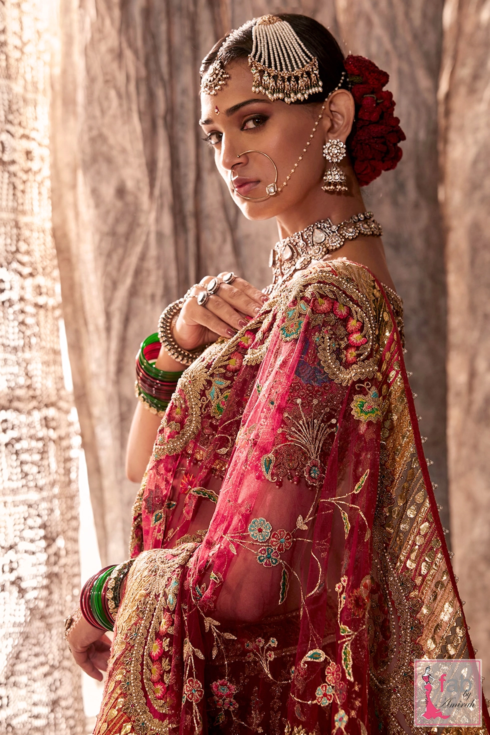 Detailed back view of the illusion choli showing scalloped hem and peacock embroidery.