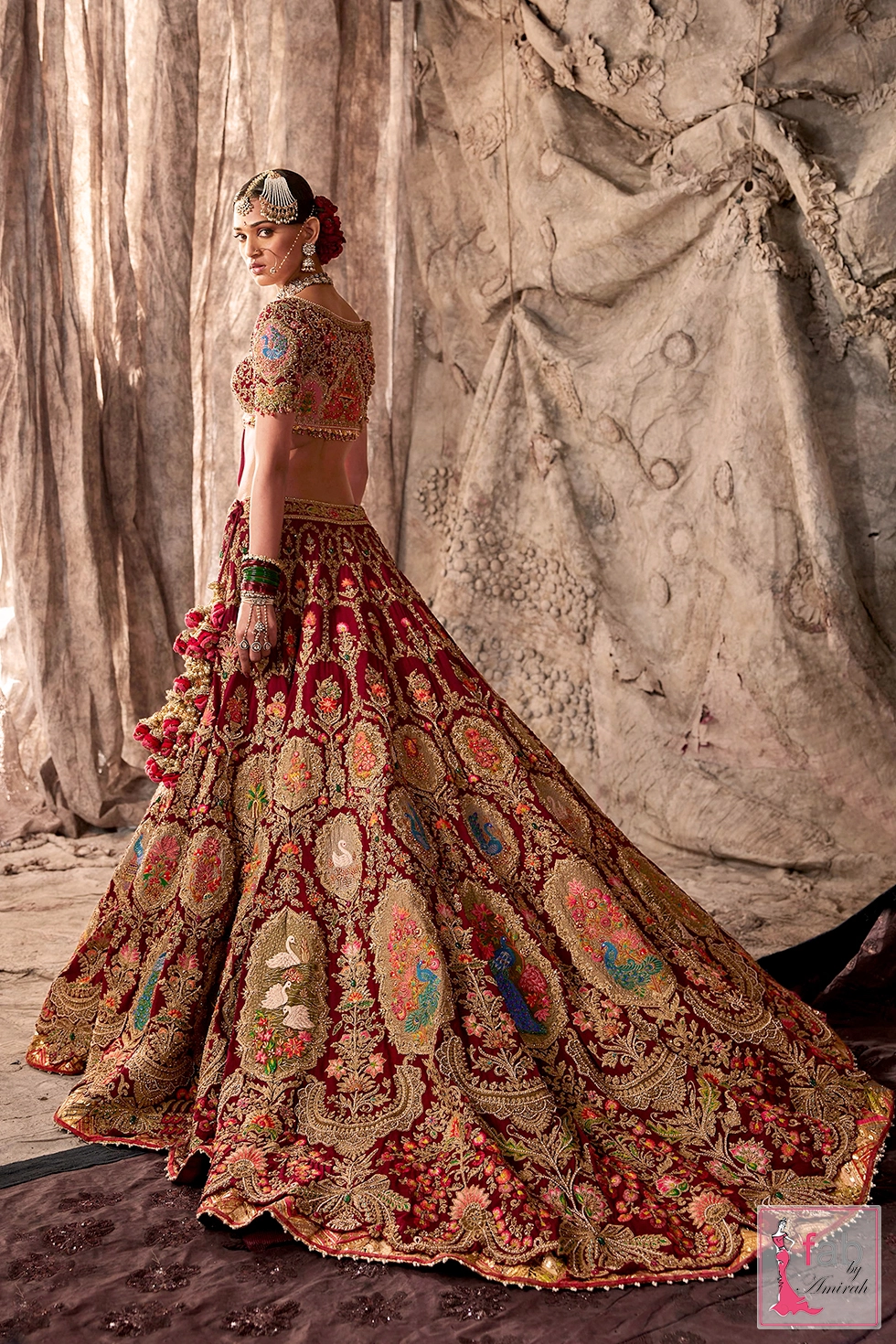 Full length view of the lehenga skirt with swan and peacock motifs.