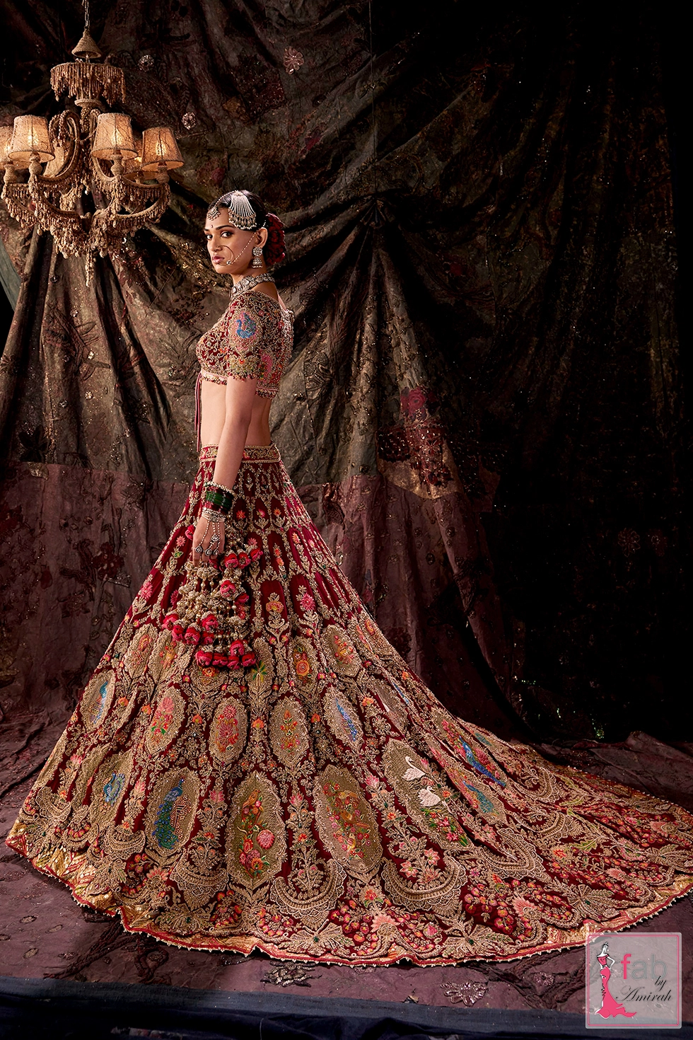 Model wearing the multi hued tulle dupatta draped over the head and shoulder.