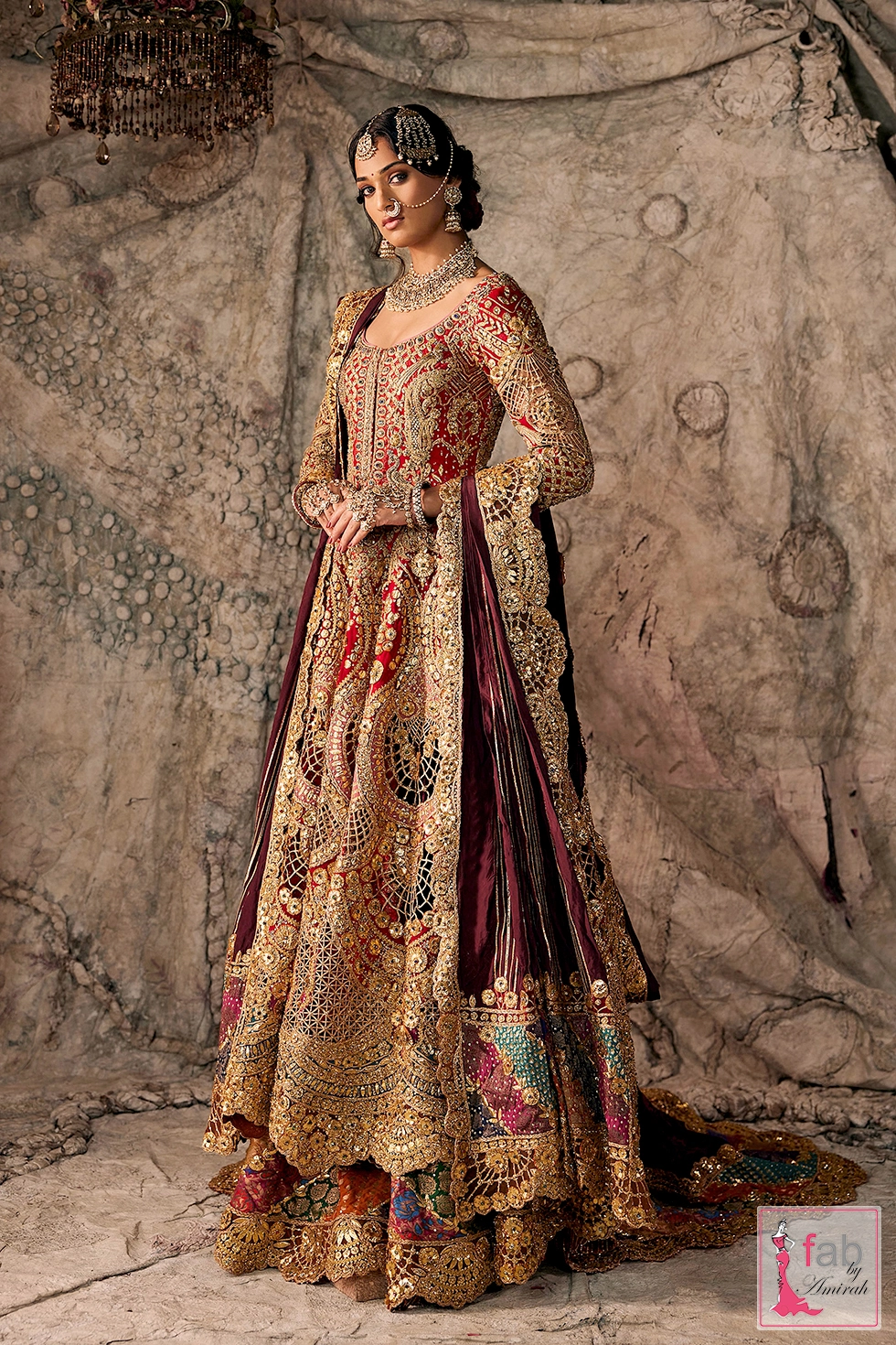 Deep red bridal pishwas set with gold cutwork embroidery and velvet lehenga
