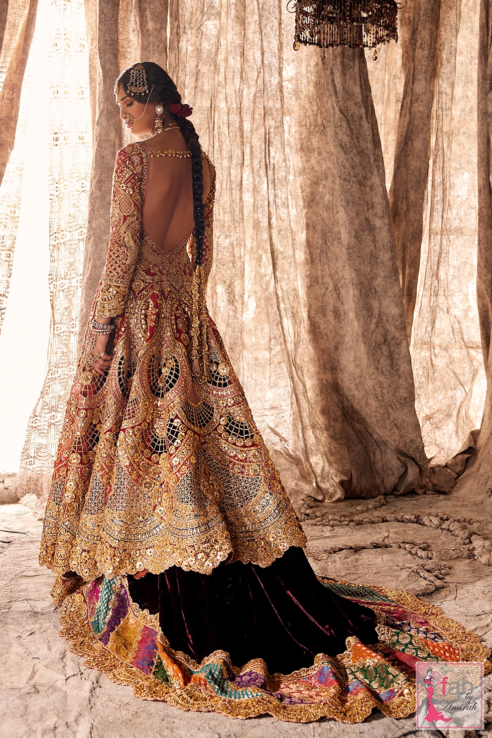 Back view displaying deep scooped back and embroidered skirt flare