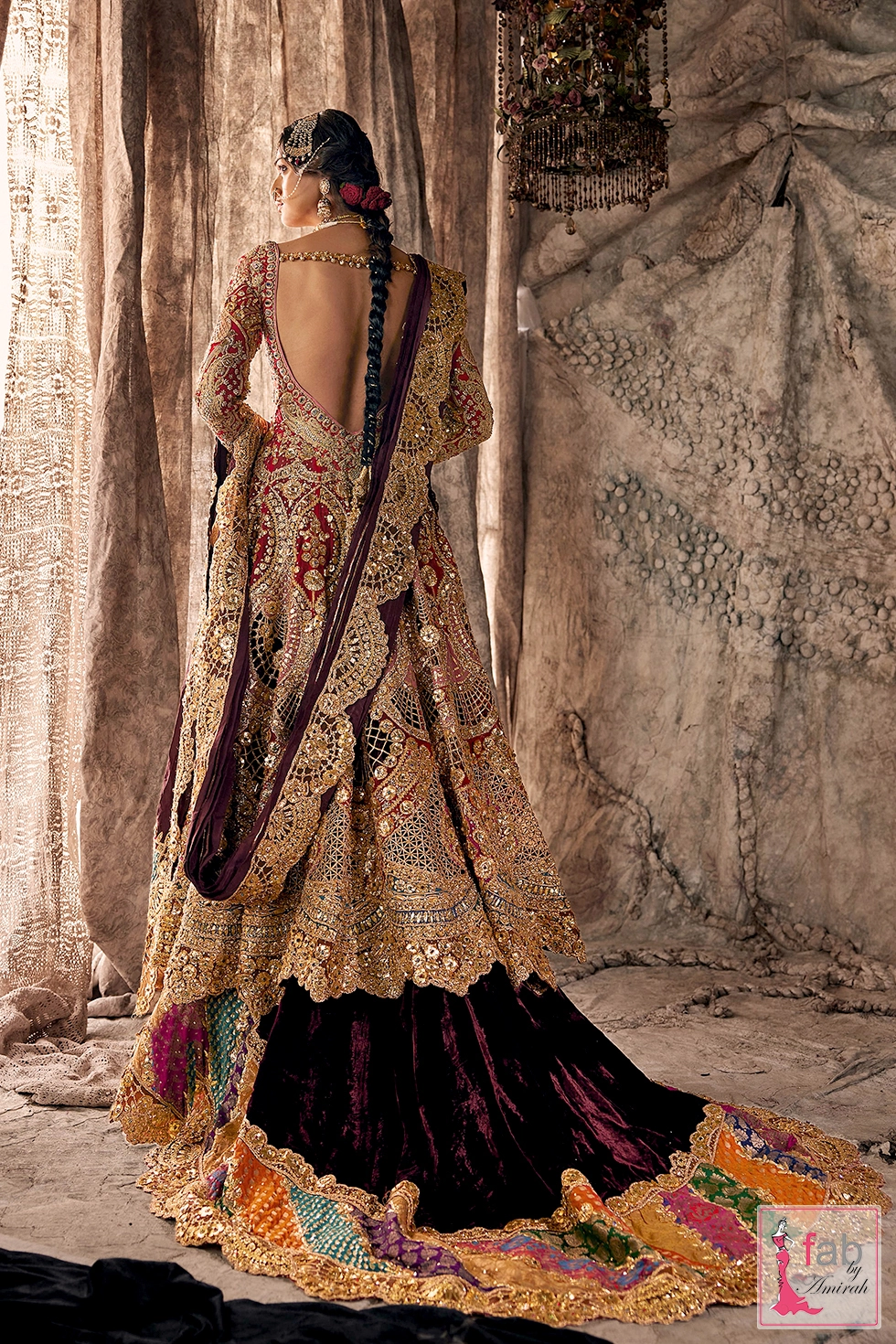 Rear angle showcasing the sweeping velvet train and multihued border