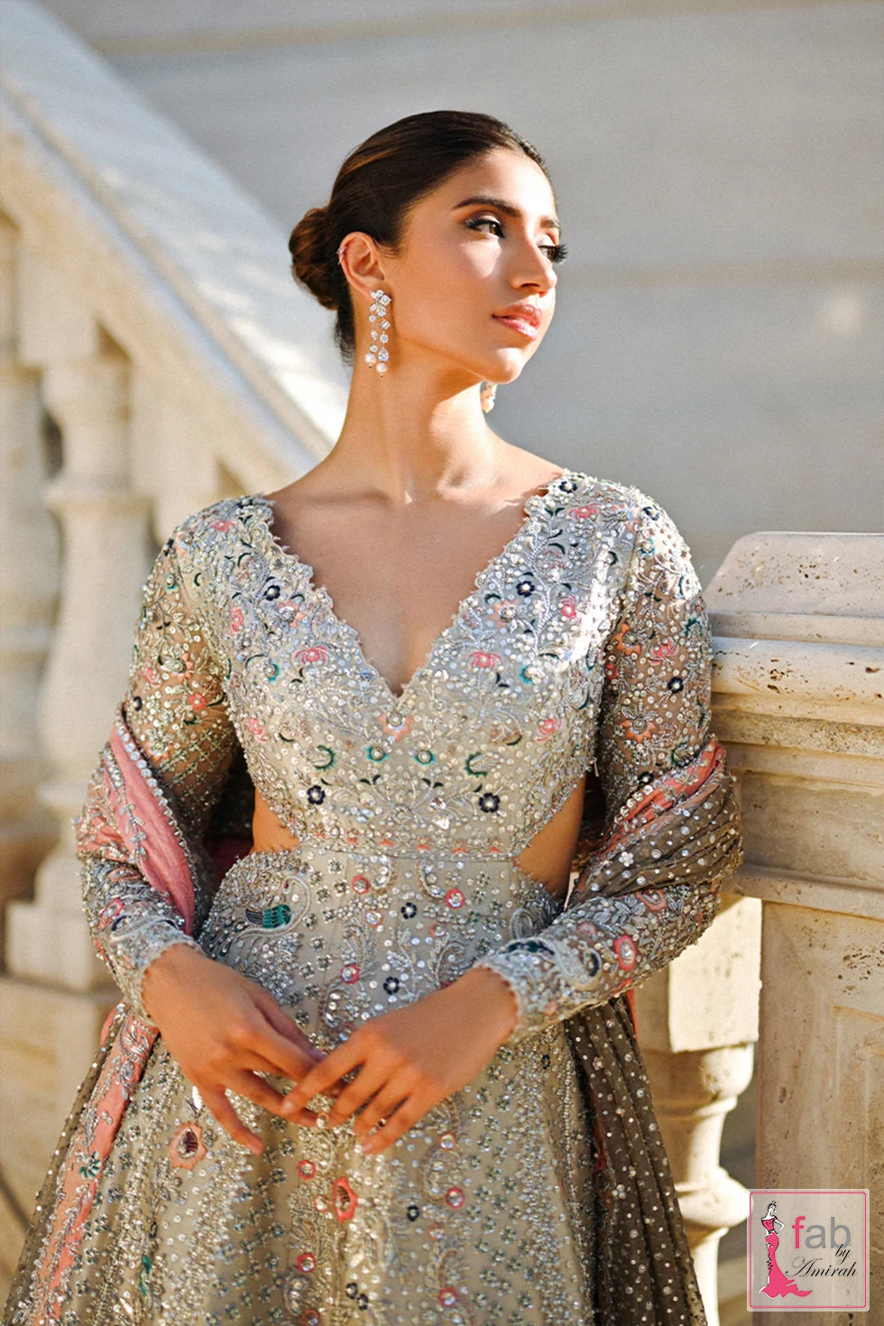 Close up of hand embroidered bodice with sequins pearls and floral resham Close up of hand embroidered bodice with sequins pearls and floral resham