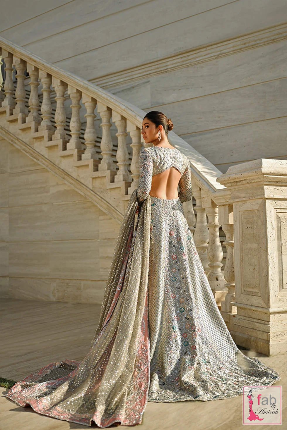 Back view of bridal gown displaying trapeze cut back and long train Back view of bridal gown displaying trapeze cut back and long train