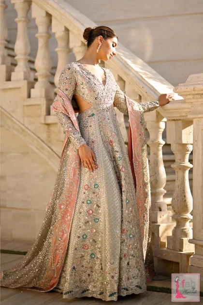 FAB By AMIRAH 7 Side profile of icy platinum embroidered bridal gown showing side cutout detail