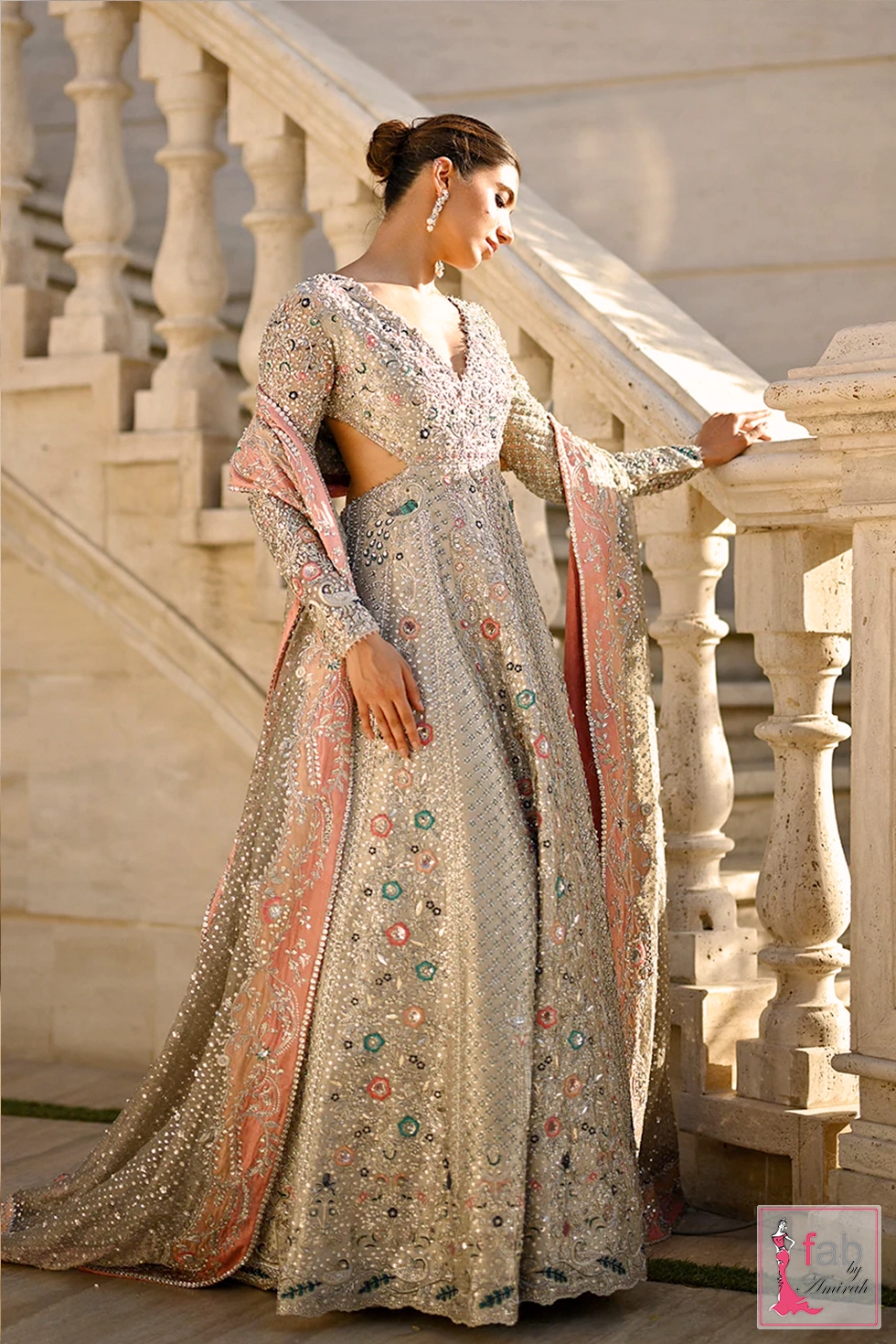Side profile of icy platinum embroidered bridal gown showing side cutout detail Side profile of icy platinum embroidered bridal gown showing side cutout detail