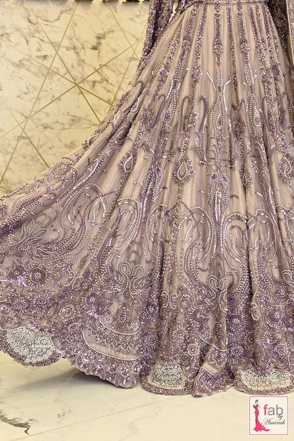 Mid section detail of heavy floral and paisley sequins embroidery