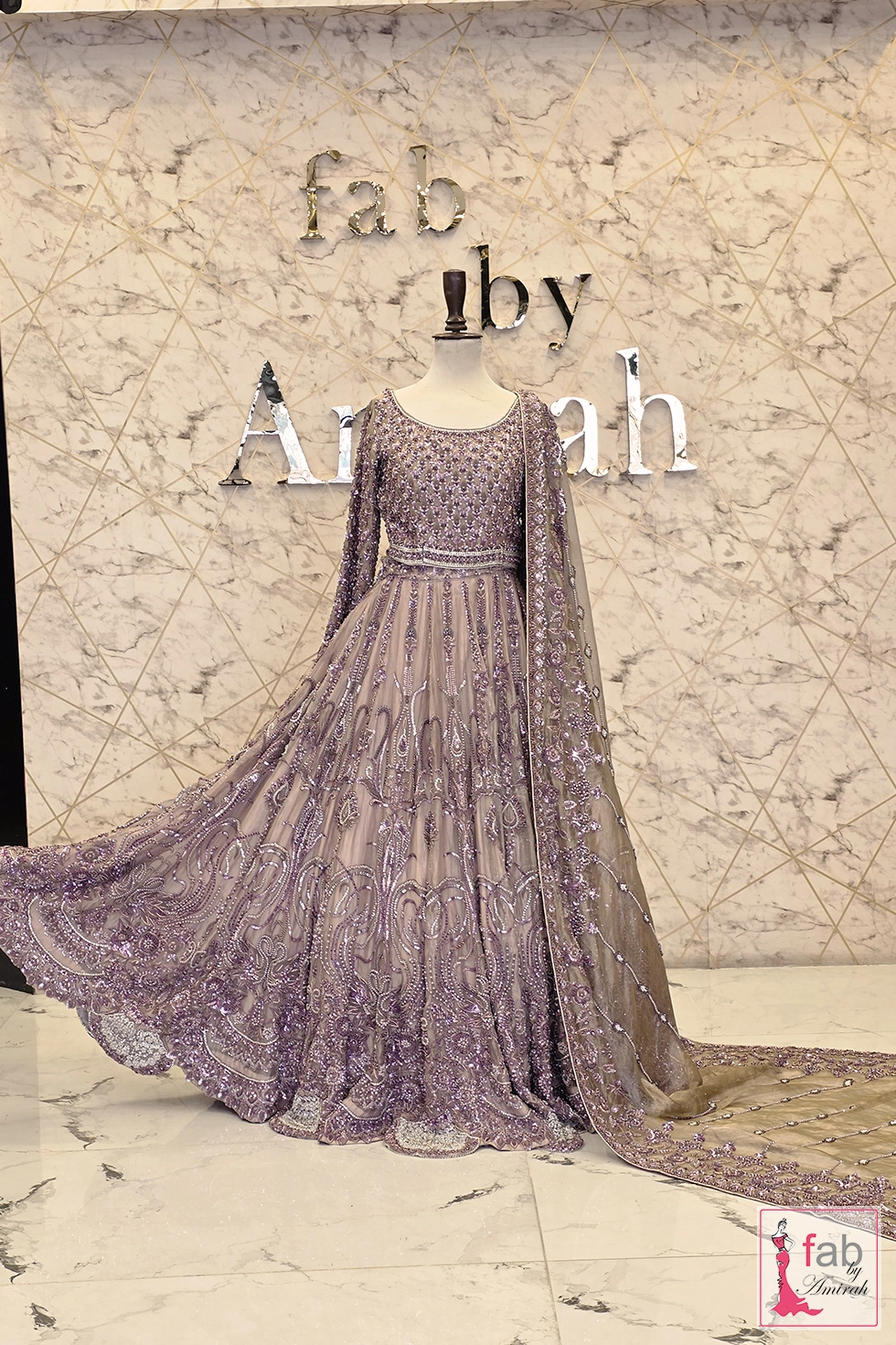Full length front view of heavy purple bridal lehenga with flared skirt