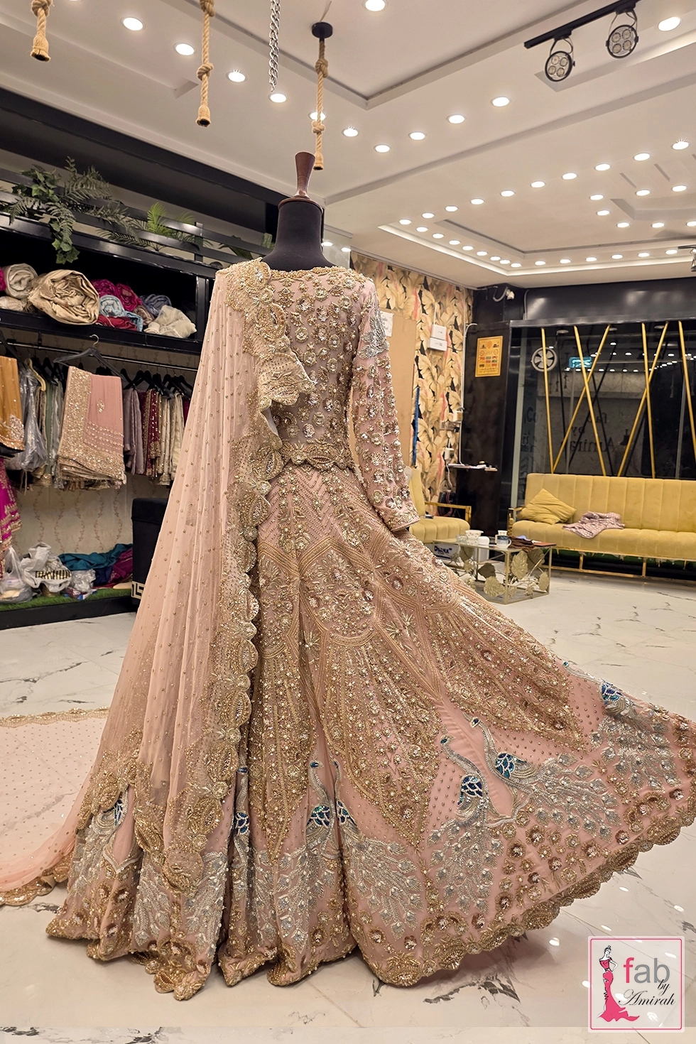 Back profile view of bridal gown and sheer draped dupatta Back profile view of bridal gown and sheer draped dupatta