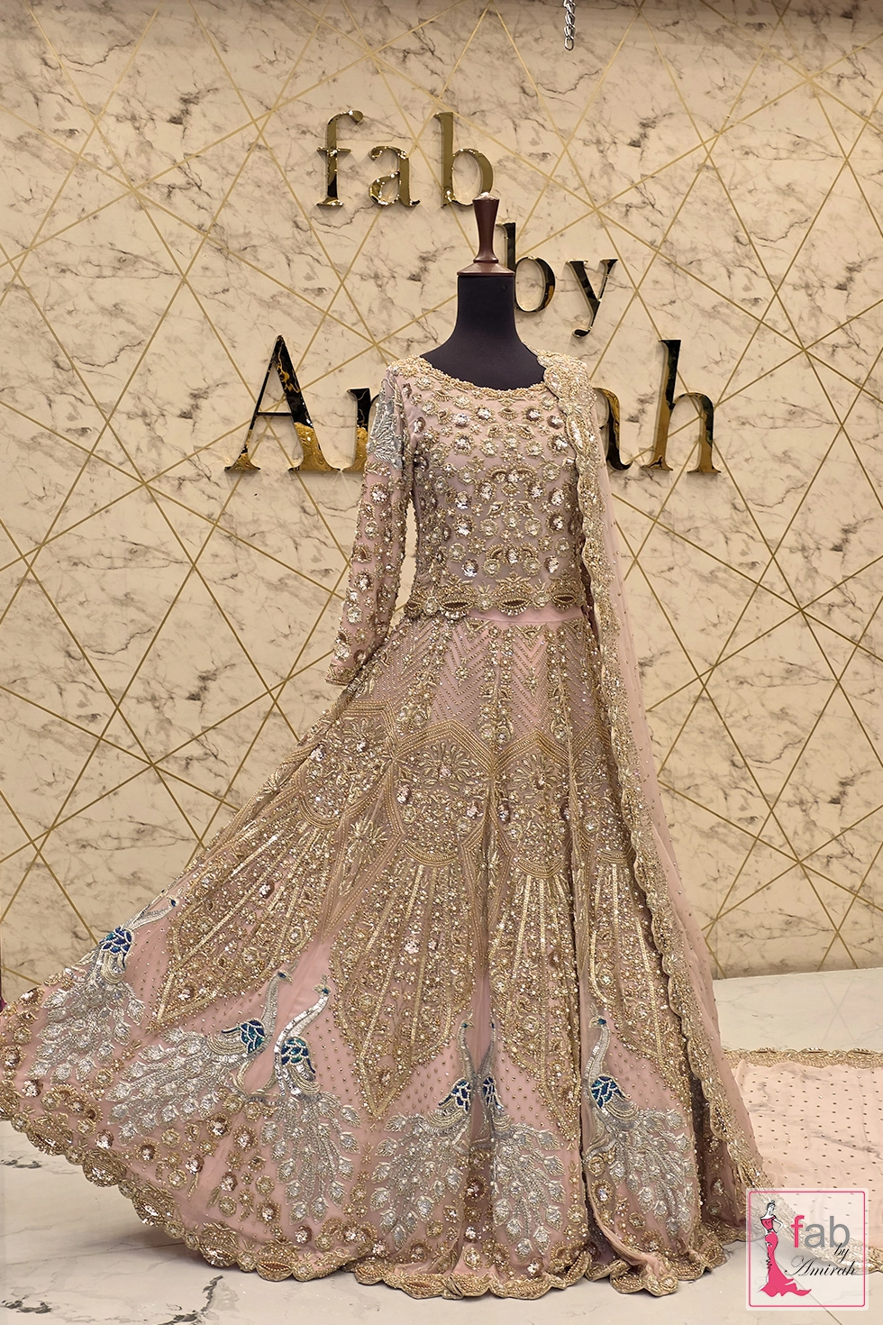 Blush Pink Bridal Lehenga with Gold Zardozi and Peacock Embroidery 1 Full length view of blush pink bridal lehenga with gold embroidery
