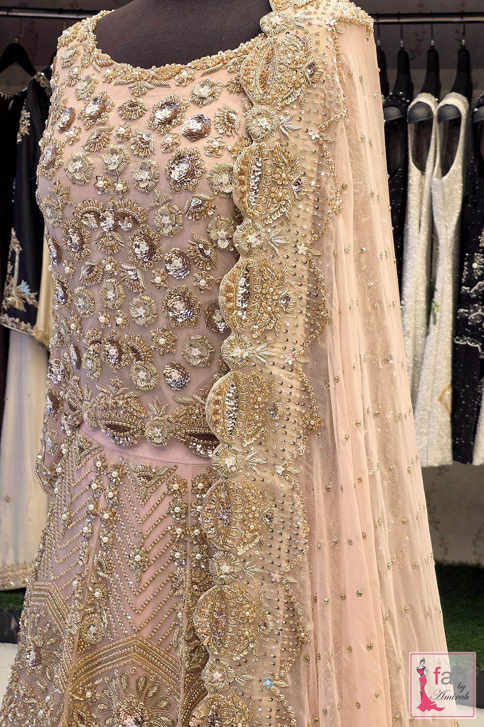 Close up of hand embroidered blouse detail and scalloped dupatta border Close up of hand embroidered blouse detail and scalloped dupatta border