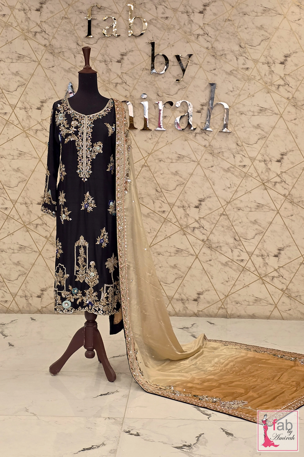 Shaded gold and beige embellished dupatta draped on showroom display Shaded gold and beige embellished dupatta draped on showroom display