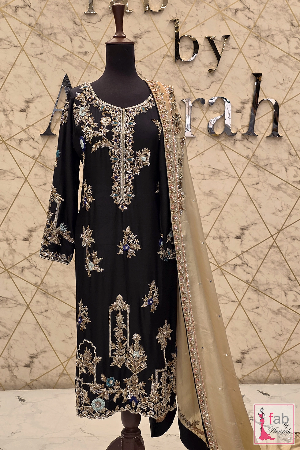 Full length front view of black embroidered silk suit on mannequin Full length front view of black embroidered silk suit on mannequin
