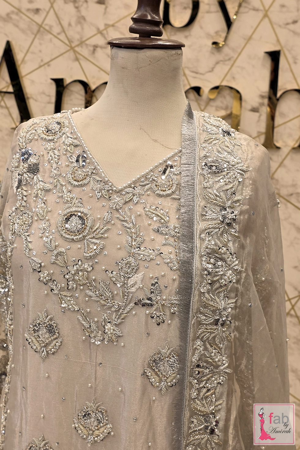 Detail shot of V neckline zardozi work and sheer dupatta border