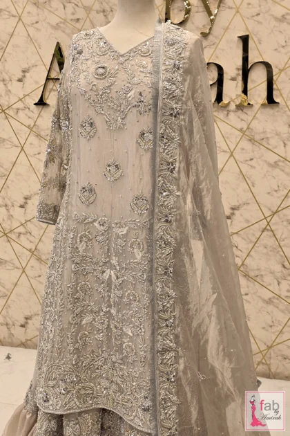 FAB By AMIRAH 6 Silver gharara suit displayed on mannequin with hand embroidered dupatta frame