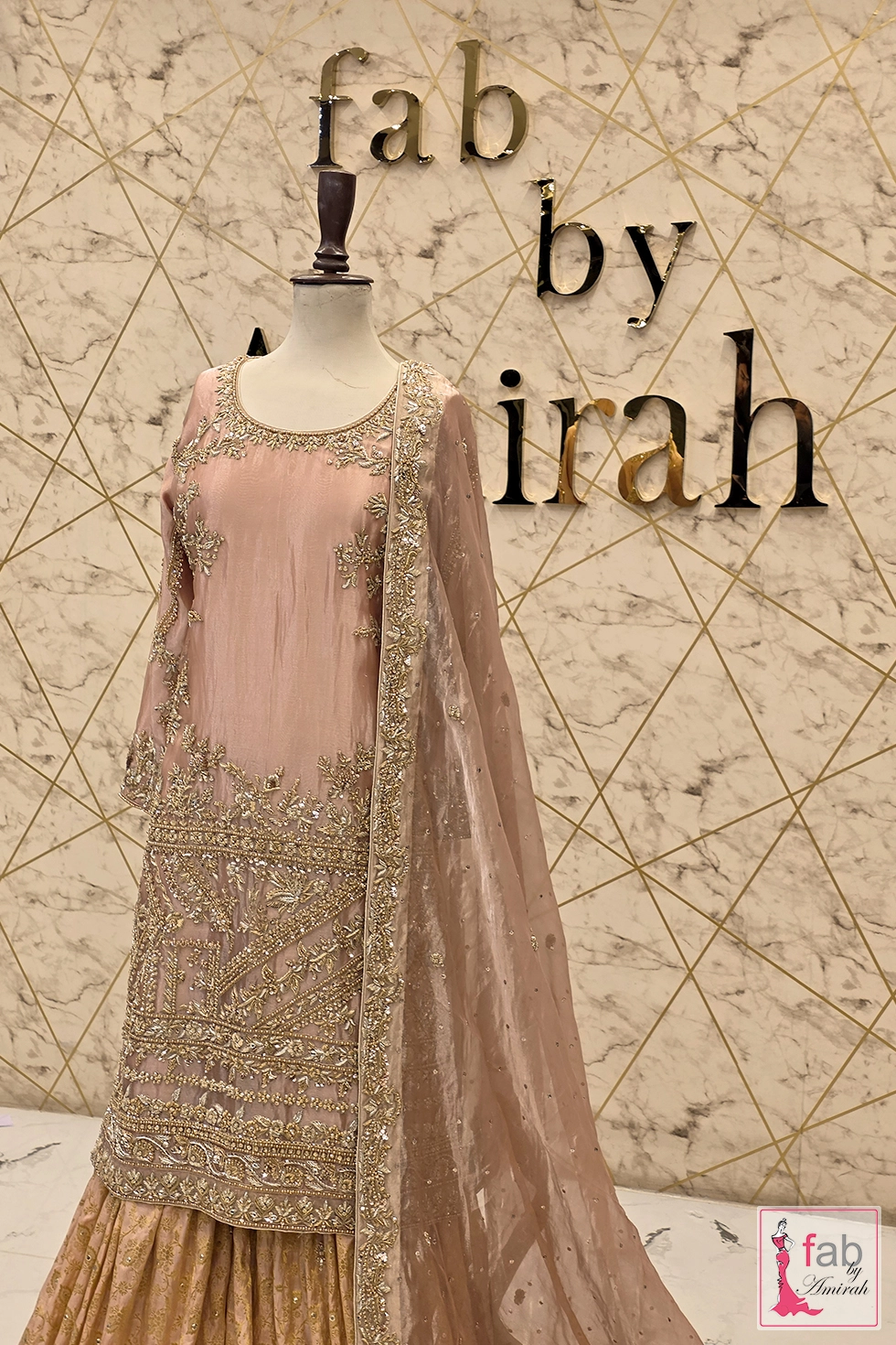 Three quarter front view showing the full embellishment layout on the long shirt and draped sheer dupatta