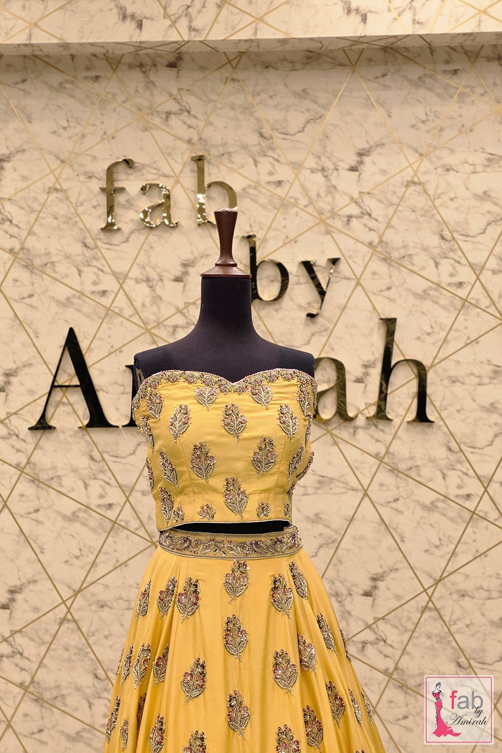 Close up of embroidered sweetheart crop top on yellow lehenga