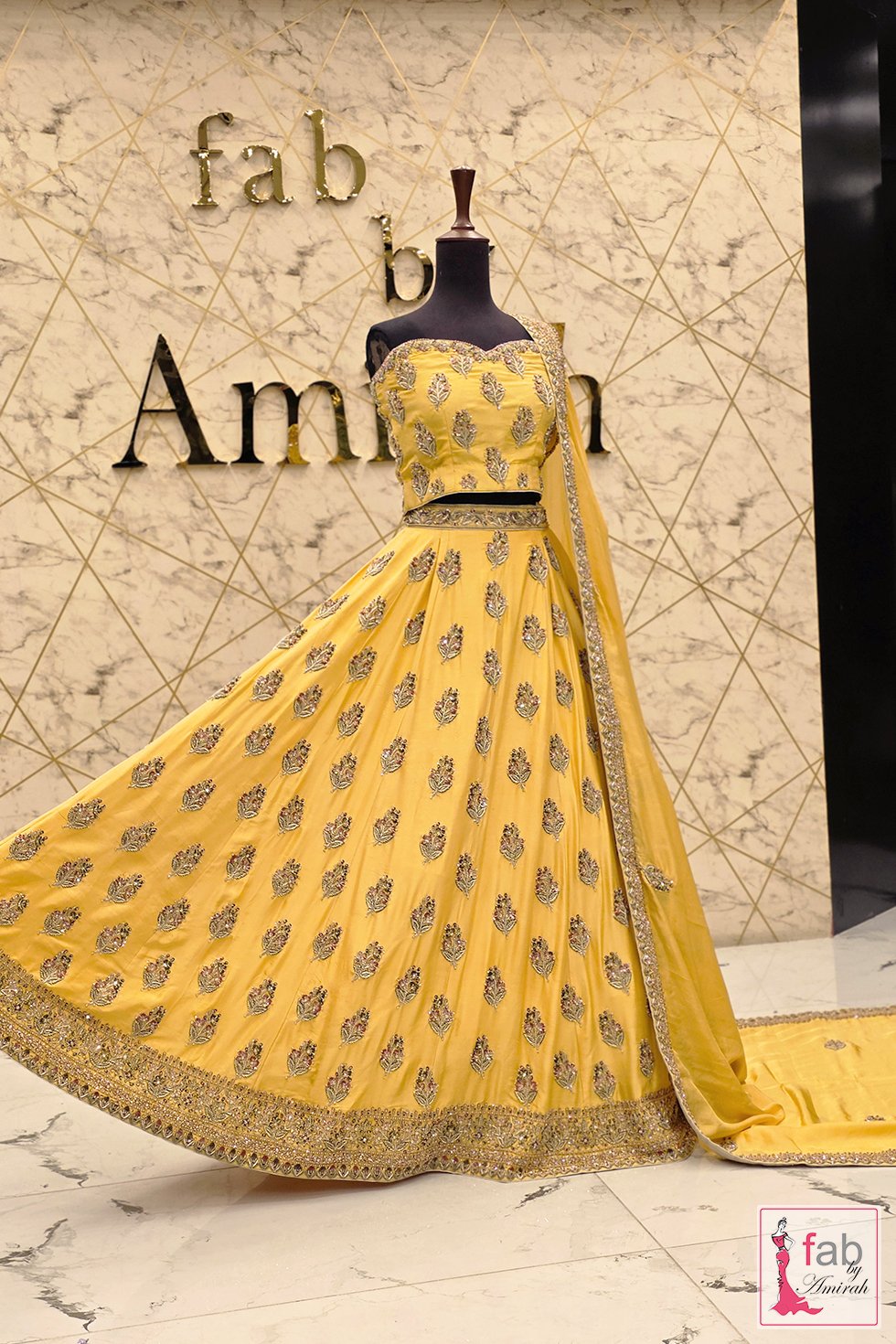 Full flare shot of yellow lehenga choli with draped dupatta