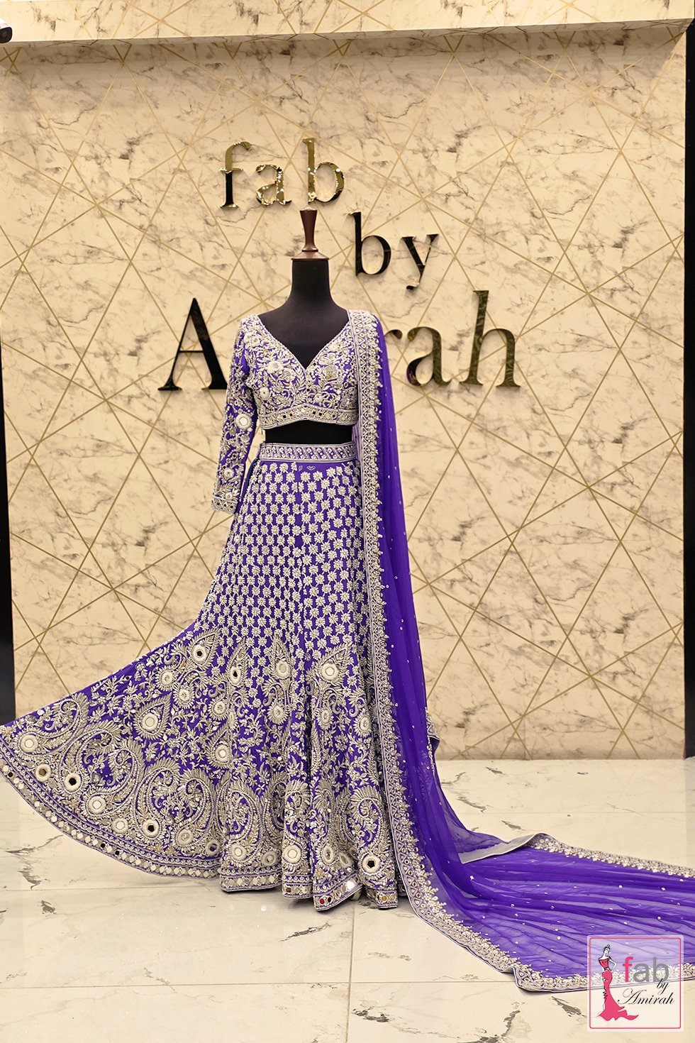 Full length draped purple bridal lehenga with dupatta spread Full length draped purple bridal lehenga with dupatta spread