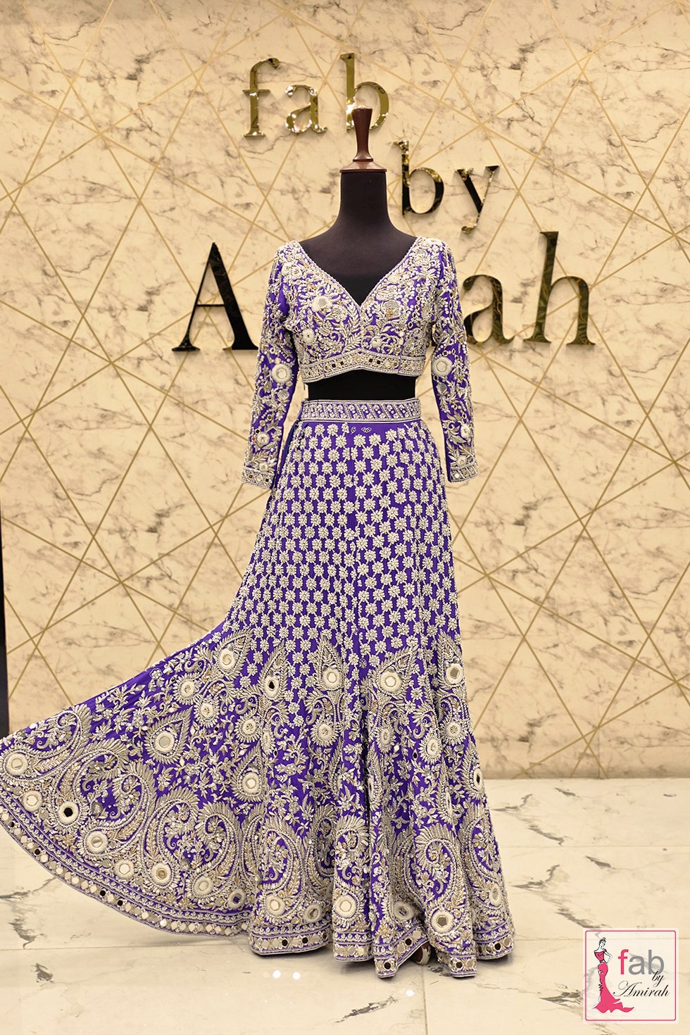 Full flare view of purple embellished lehenga skirt hem Full flare view of purple embellished lehenga skirt hem